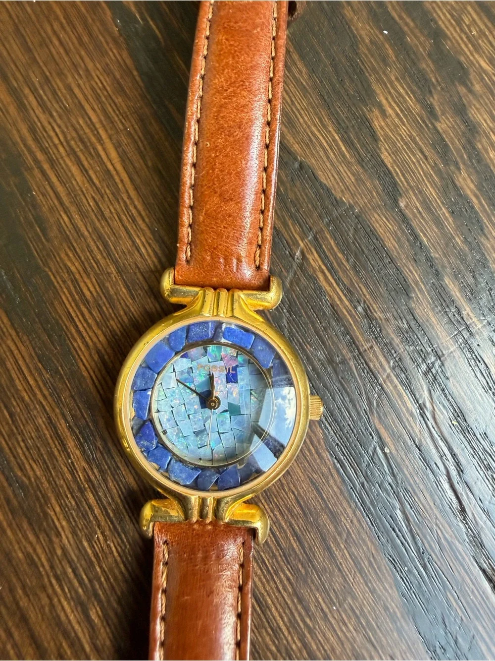Vintage Fossil watch with a brown leather strap.